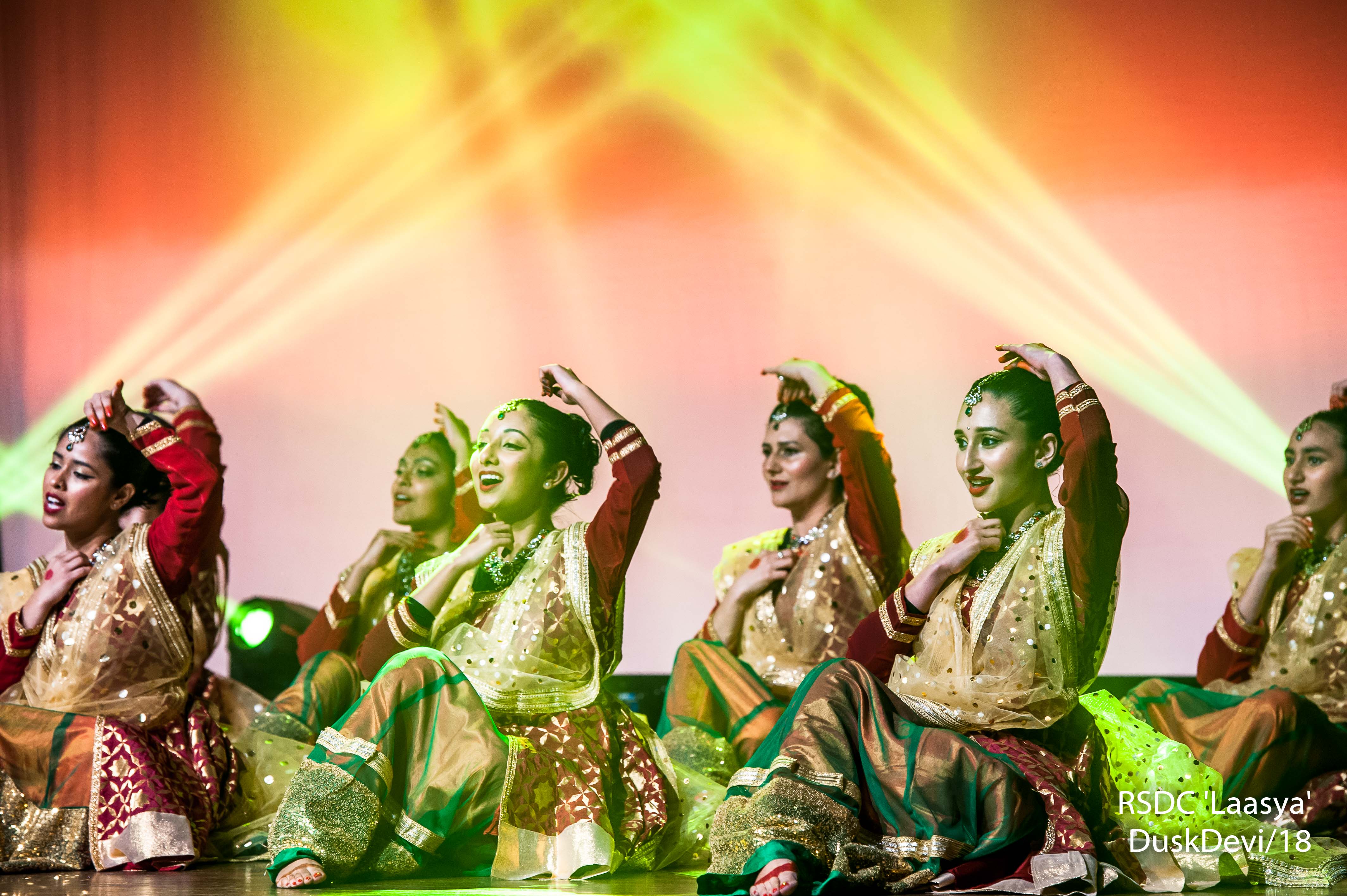 Ruchi Sanghi Dance Company Contact Banner dancers performing sitting on stage